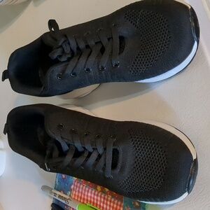 Pair of black athletic shoe fashion professional skateboard shoe brand